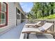Outdoor deck with two chaise lounges overlooking mature trees and a sunny sky at 2104 Royal Pine Dr, Seabrook Island, SC 29455