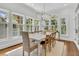 Spacious dining area with natural light and table with seating for eight people at 2104 Royal Pine Dr, Seabrook Island, SC 29455
