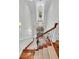 Bright, soaring two-story foyer with hardwood staircase and grand chandelier at 2104 Royal Pine Dr, Seabrook Island, SC 29455