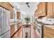 Eat-in kitchen with center island, custom wood cabinets and stainless steel appliances at 2104 Royal Pine Dr, Seabrook Island, SC 29455