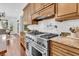 Gourmet kitchen featuring stainless steel stove and custom wood cabinets at 2104 Royal Pine Dr, Seabrook Island, SC 29455