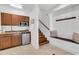 Cozy kitchenette with wooden cabinets, stainless steel appliances, and a small dining area at 2104 Royal Pine Dr, Seabrook Island, SC 29455