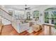 Spacious living room with hardwood floors, arched windows, and comfortable seating at 2104 Royal Pine Dr, Seabrook Island, SC 29455