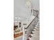 Beautiful living room with hardwood floors, wrought iron staircase, and neutral decor at 2104 Royal Pine Dr, Seabrook Island, SC 29455
