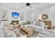 Comfortable living room with a fireplace and large screen television for entertaining at 2104 Royal Pine Dr, Seabrook Island, SC 29455