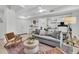 Finished basement with stylish seating, tile floors, modern lighting, and convenient access to the outside at 2104 Royal Pine Dr, Seabrook Island, SC 29455
