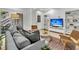 Bright living area featuring comfortable seating, modern decor, and a TV for entertainment at 2104 Royal Pine Dr, Seabrook Island, SC 29455
