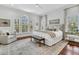 A spacious main bedroom with a large window and an area rug at 2104 Royal Pine Dr, Seabrook Island, SC 29455