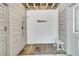 Convenient outdoor shower with wood plank flooring, wood plank walls, and door to the home at 2104 Royal Pine Dr, Seabrook Island, SC 29455