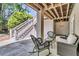 Inviting patio with wicker seating, stairs to upper deck, and wood-beam ceiling offering a relaxing outdoor space at 2104 Royal Pine Dr, Seabrook Island, SC 29455