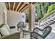 Outdoor patio featuring wicker furniture, a glass coffee table, and a stairway leading to the upper level at 2104 Royal Pine Dr, Seabrook Island, SC 29455