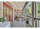Screened porch with dining table, multiple seating areas, and views of the surrounding landscape at 2104 Royal Pine Dr, Seabrook Island, SC 29455