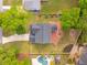 Aerial view displays a backyard oasis with a fire pit, lush lawn, and beautifully landscaped areas at 217 7Th Ave, Mount Pleasant, SC 29464