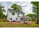 Expansive backyard with a well-maintained lawn, a fire pit, and an outdoor entertaining area at 217 7Th Ave, Mount Pleasant, SC 29464