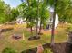 Expansive backyard featuring lush landscaping, a fire pit area, screened porch and outdoor seating at 217 7Th Ave, Mount Pleasant, SC 29464