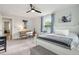 Comfortable bedroom featuring neutral walls, ceiling fan, carpet and a white framed bed and natural light at 217 7Th Ave, Mount Pleasant, SC 29464