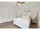 Bright bedroom with hardwood floors, white trim, and a ceiling fan at 217 7Th Ave, Mount Pleasant, SC 29464