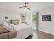 Bedroom with hardwood floors, neutral walls, a ceiling fan, and windows with natural light at 217 7Th Ave, Mount Pleasant, SC 29464