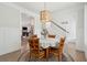 Cozy dining area featuring an elegant chandelier, round table with seating for four, and an open-concept design at 217 7Th Ave, Mount Pleasant, SC 29464