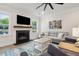 Cozy living room has a fireplace with a flatscreen, comfortable seating and decor at 217 7Th Ave, Mount Pleasant, SC 29464