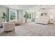 Spacious main bedroom featuring a sitting area and large picture windows at 217 7Th Ave, Mount Pleasant, SC 29464
