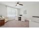 Well-lit room featuring an office area with a white desk, comfortable chair and large sunny window at 217 7Th Ave, Mount Pleasant, SC 29464