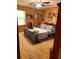 Wood-paneled bedroom with decorative items, a comfortable bed, and overhead lighting at 240 Kerrison St, Varnville, SC 29944