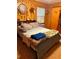 Bedroom showcasing unique wood decor, a comfortable bed, and ample natural light at 240 Kerrison St, Varnville, SC 29944