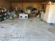 Spacious garage with concrete floor, storage shelves, and ample room for vehicles at 240 Kerrison St, Varnville, SC 29944