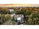 Aerial view of the home, deck, patio and mature trees at 2530 Jasper Blvd, Sullivans Island, SC 29482