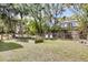Serene backyard with a fenced perimeter, garden beds, and lounge chairs, offering privacy and relaxation at 2530 Jasper Blvd, Sullivans Island, SC 29482