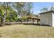 Backyard featuring a charming shed with an overhang on a grassy lot and perimeter fencing at 2530 Jasper Blvd, Sullivans Island, SC 29482