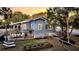The backyard features a wooden deck with outdoor dining and lounge area at 2530 Jasper Blvd, Sullivans Island, SC 29482