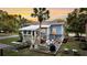 Spacious backyard with a large wooden deck, outdoor seating, and a grilling area at 2530 Jasper Blvd, Sullivans Island, SC 29482