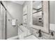 Well-lit bathroom featuring a glass shower, vanity with marble countertop, and a stylish faucet at 2530 Jasper Blvd, Sullivans Island, SC 29482