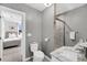 Modern bathroom with tiled shower, toilet, and vanity, connecting to a bedroom at 2530 Jasper Blvd, Sullivans Island, SC 29482