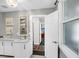 Bright bathroom with a marble vanity, modern fixtures, and a tiled shower visible through a doorway at 2530 Jasper Blvd, Sullivans Island, SC 29482