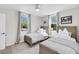 Bright bedroom with two twin beds, soft carpeting, and a ceiling fan at 2530 Jasper Blvd, Sullivans Island, SC 29482