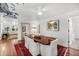 Dining room featuring hardwood floors, seating for six, and a custom ceiling mural at 2530 Jasper Blvd, Sullivans Island, SC 29482