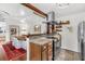 Open-concept kitchen with granite countertops, stainless steel appliances, and seamless flow to dining area at 2530 Jasper Blvd, Sullivans Island, SC 29482