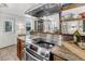 Bright kitchen featuring granite countertops, stainless steel appliances, and an open design at 2530 Jasper Blvd, Sullivans Island, SC 29482