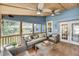 Bright sun room with comfortable seating, lots of natural light, and stylish decor at 2530 Jasper Blvd, Sullivans Island, SC 29482