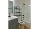Bathroom with a gray vanity, updated fixtures, and a tub/shower combination at 26 Elmora Ave, Goose Creek, SC 29445
