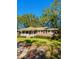 Inviting single-story brick home with a cozy front porch and well-manicured lawn at 26 Elmora Ave, Goose Creek, SC 29445