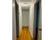 Hallway with original hardwood floors and white walls at 26 Elmora Ave, Goose Creek, SC 29445