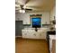 Bright kitchen features classic white cabinets, laminate wood flooring, and modern appliances at 26 Elmora Ave, Goose Creek, SC 29445