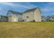 Spacious backyard featuring a shed, well-maintained lawn, and a view of the house at 3033 Kinswood Ln, Ladson, SC 29456