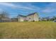 Spacious backyard featuring a shed, well-maintained lawn, and a privacy fence at 3033 Kinswood Ln, Ladson, SC 29456