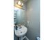 Half bathroom featuring pedestal sink, framed mirror, and neutral paint at 3033 Kinswood Ln, Ladson, SC 29456