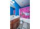 Blue bathroom with sink vanity, pink shower curtain, toilet, and mirror at 3033 Kinswood Ln, Ladson, SC 29456